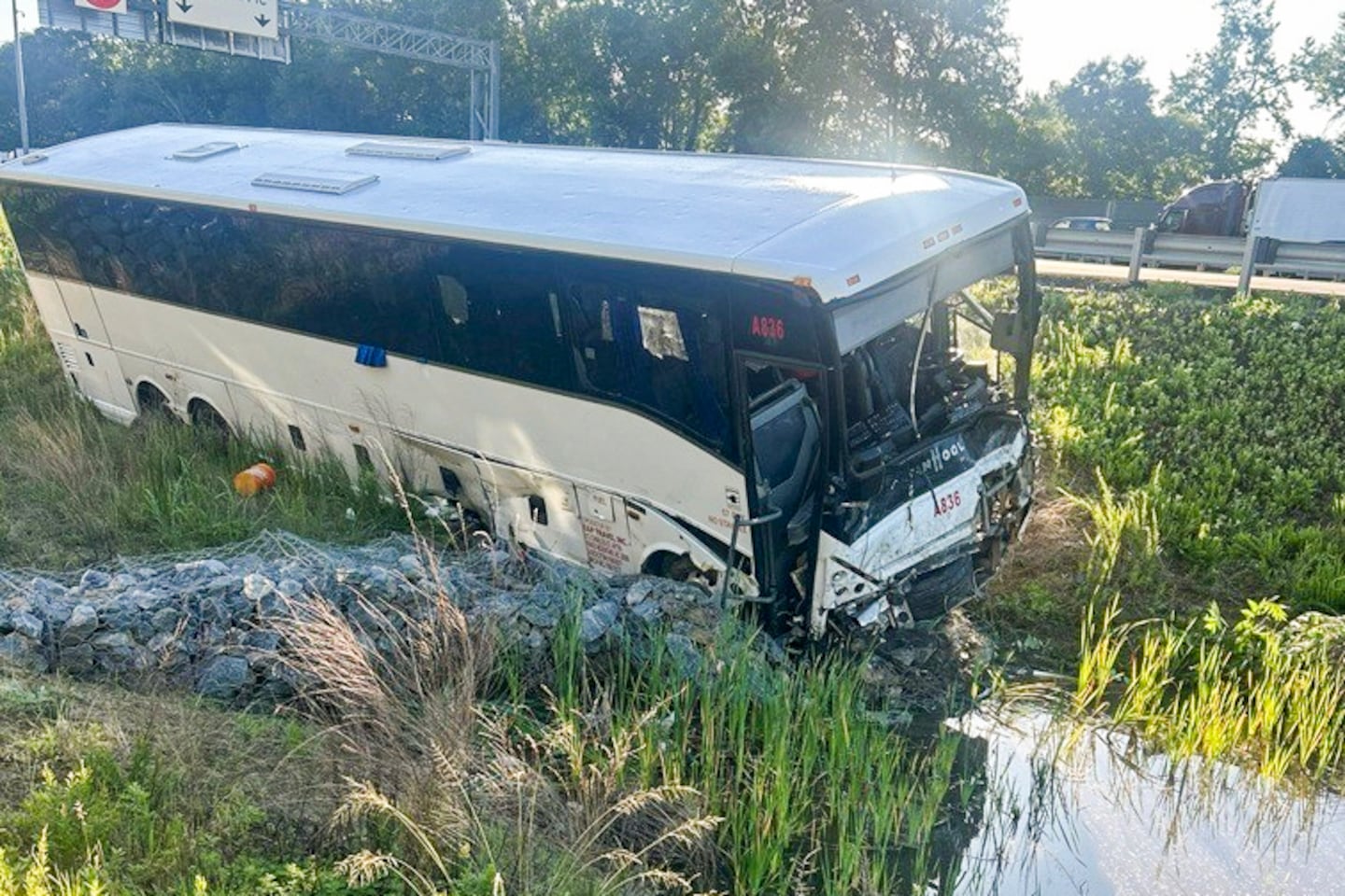 In an image provided by Virginia state police, a bus sits damaged after hitting multiple vehicles on I-95 near Quantico, Va., on Friday, May 29, 2026.