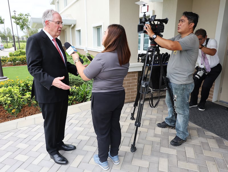 Elder Neil L. Andersen of the Quorum of the Twelve Apostles is interviewed by a journalist on Bacolod Philippines Temple grounds in Bacolod City, Philippines, on Saturday, May 30, 2026.