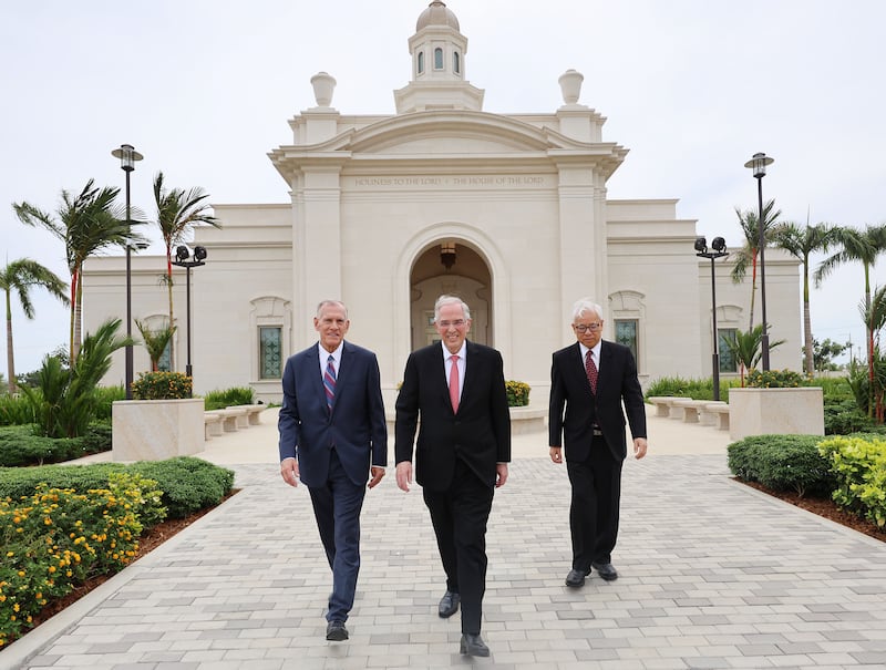 Elder Neil L. Andersen of the Quorum of the Twelve Apostles, center,Elder Steven R. Bangerter, General Authority Seventy and executive director of the Temple Department, left, and Elder Chi Hong (Sam) Wong, General Authority Seventy and first counselor in the Philippines Area presidency, walk near the Bacolod Philippines Temple in Bacolod City, Philippines, on Saturday, May 30, 2026.
