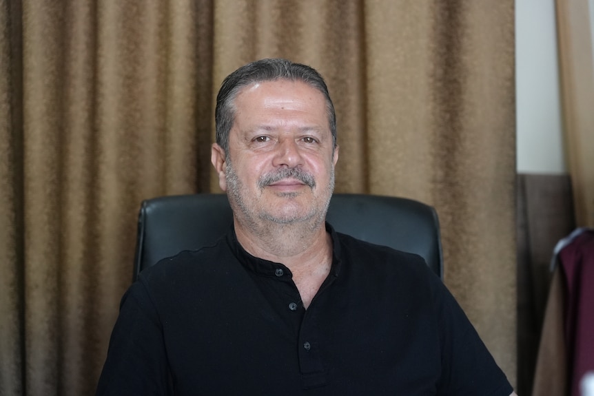 A close up of a Lebanese man wearing a black shirt.