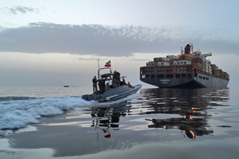 This photo obtained by AFP from the Iranian news agency Tasnim shows an Islamic Revolutionary Guard Corps (IRGC) boat allegedly taking part in an operation to seize ships attempting to cross the Strait of Hormuz, on April 21, 2026.