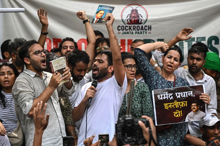 Cockroach Janta Party (CJP) founder Abhijeet Dipke (C) shouts slogans during a protest over alleged irregularities in the country's major examinations, in New Delhi on June 6, 2026.
