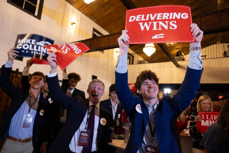 JACKSON, GEORGIA - JUNE 16: Supporters cheer on U.S. Senate Republican candidate, U.S. Rep. Mike Collins (R-GA) during a runoff election-night party on June 16, 2026 in Jackson, Georgia. Collins has the endorsement of U.S. President Donald Trump in the Republican runoff against former football coach Derek Dooley to face Sen. Jon Ossoff (D-GA) in the general election in November. Jessica McGowan/Getty Images/AFP (Photo by Jessica McGowan / GETTY IMAGES NORTH AMERICA / Getty Images via AFP)