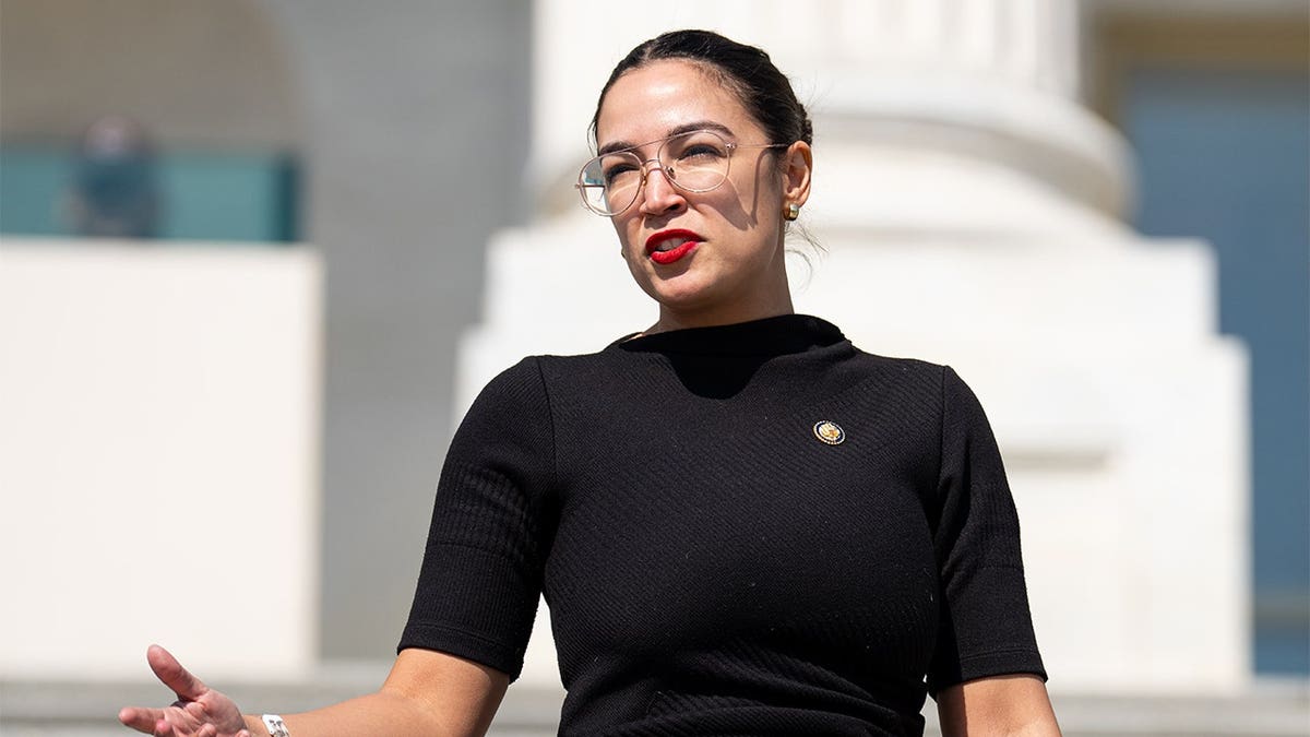 Rep. Alexandria Ocasio-Cortez walking down House steps at U.S. Capitol