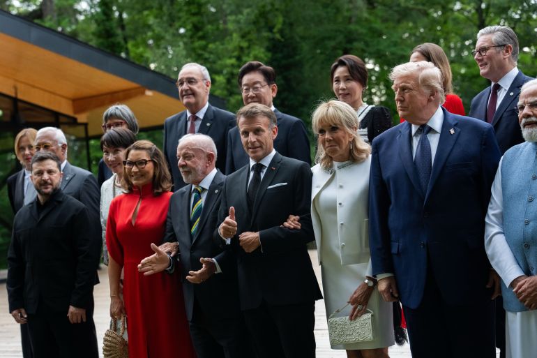 Italy's Prime Minister Giorgia Meloni, European Council President Antonio Costa, Ukraine's President Volodymyr Zelenskyy, Japan's Prime minister Sanae Takaichi, Switzerland's President Guy Parmelin, Switzerland's first lady Caroline Merotto, Brazil's President Luiz Inacio Lula da Silva, South Korea's President Lee Jae-myung, France's President Emmanuel Macron, South Korea's first lady Kim Hea Kyung, France's first lady Brigitte Macron, Britain's first lady Victoria Starmer, President Donald Trump, Britain's Prime Minister Keir Starmer, India's Prime Minister Narendra Modi and others pose for a group photo at the G7 Summit, Tuesday, June 16, 2026, in Evian-les-Bains, France. (AP Photo/Julia Demaree Nikhinson)