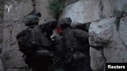 Israeli troops seize the Beaufort Castle and a strategic ridge in southern Lebanon.