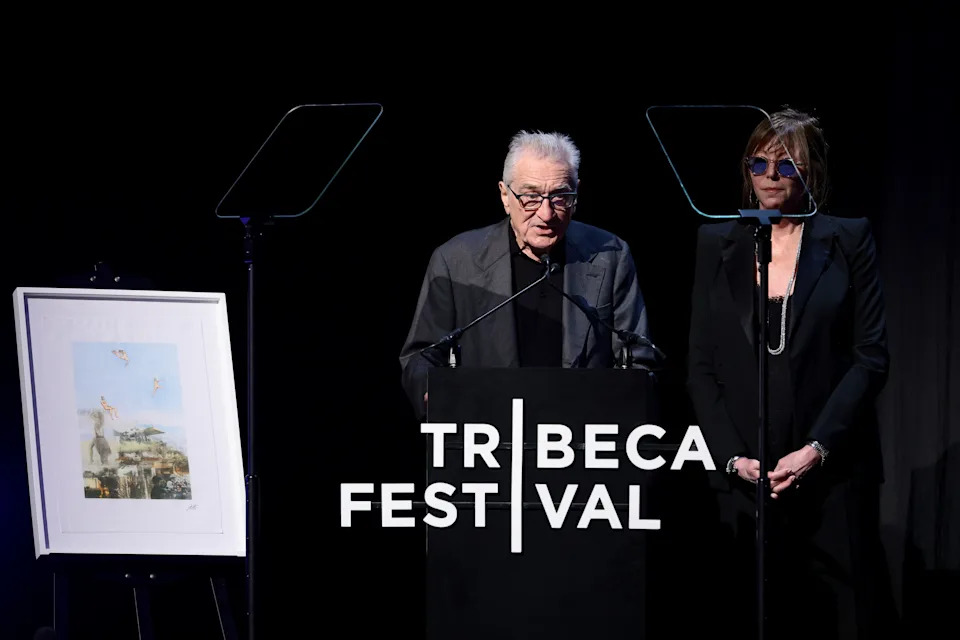 Robert De Niro, left, and Jane Rosenthal introduce Bruce Springsteen and Bono at Tribeca Festival on June 13 in New York.