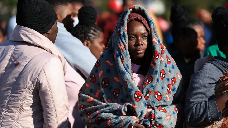 Zimbabwean migrants camp outside the Zimbabwe Consulate amid fears of anti-immigrant violence ahead of a June 30 deadline set by activists demanding undocumented migrants leave the country in Cape Town, South Africa, on June 24. - Esa Alexander/Reuters