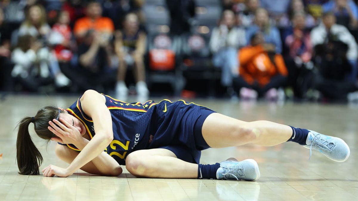 Indiana Fever guard Caitlin Clark reacting after getting hit in the eye during a WNBA playoff game