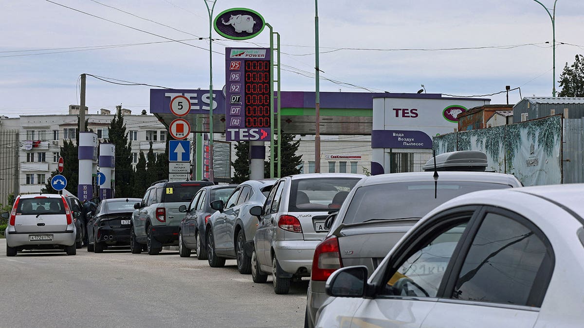 Cars queue for fuel at a gas station in Russia