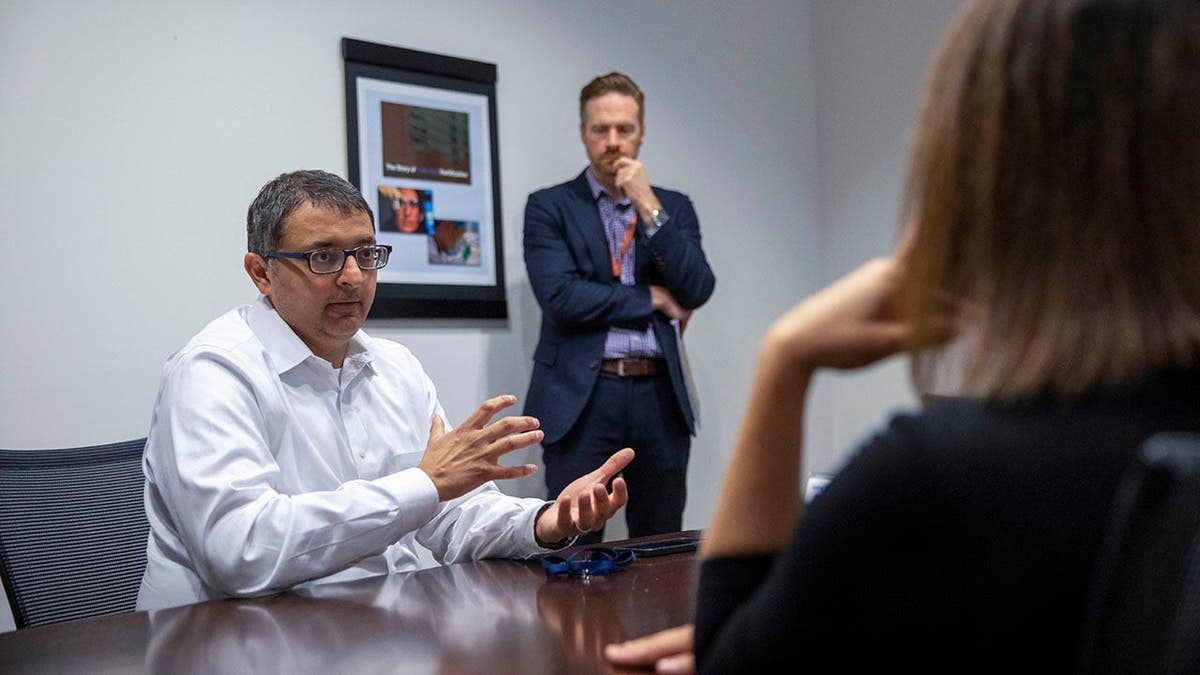 Nirav Shah and Kevin Griffis discussing COVID-19 vaccine rollout at CDC headquarters in Atlanta