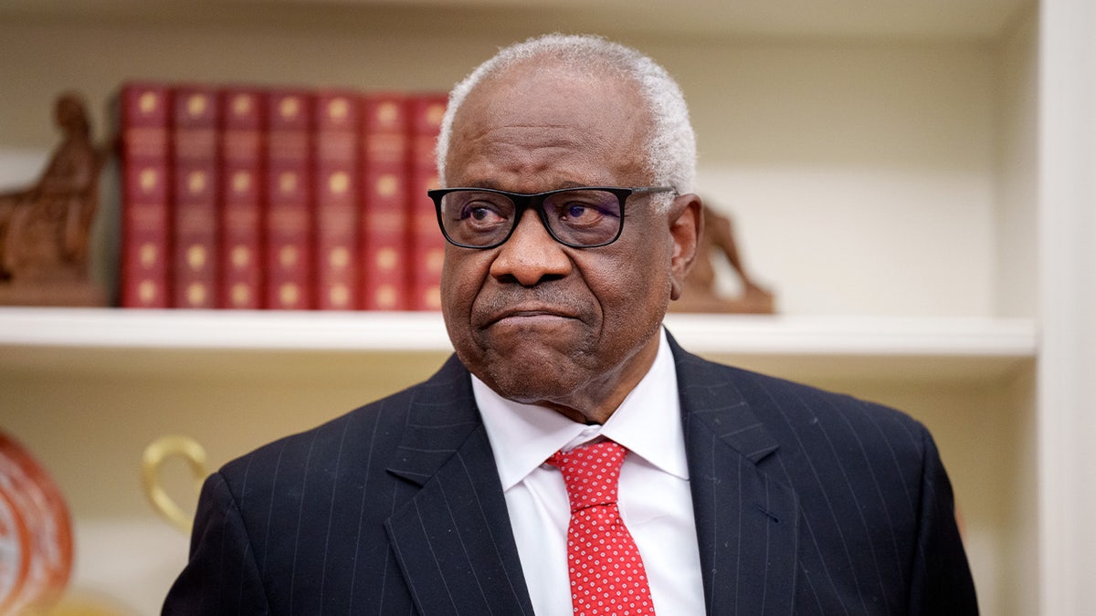 U.S. Supreme Court Justice Clarence Thomas seated in the Oval Office at the White House