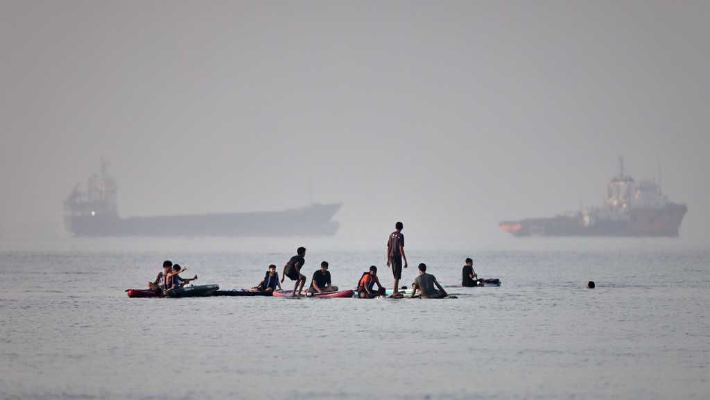 Sirens blare as Iranian missiles, drones head for Gulf neighbors