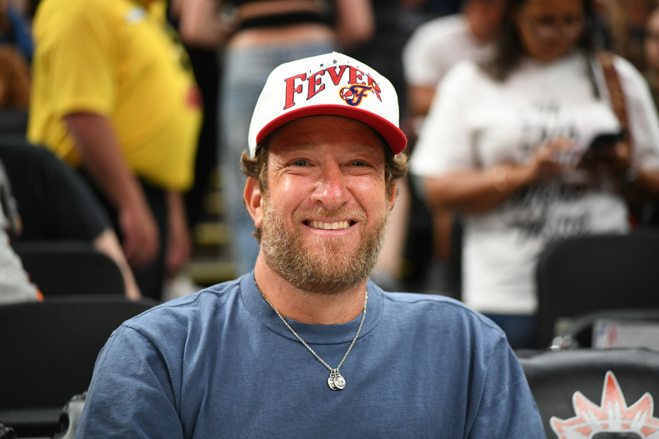 Dave Portnoy, wearing an Indiana Fever hat, poses for a photo while attending a WNBA game between the Indiana Fever and the Connecticut Sun on July 15, 2025