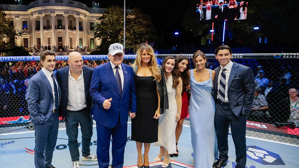 US President Donald Trump and First Lady Melania Trump stand in the Octagon with UFC president Dana White and guests on the White House South Lawn