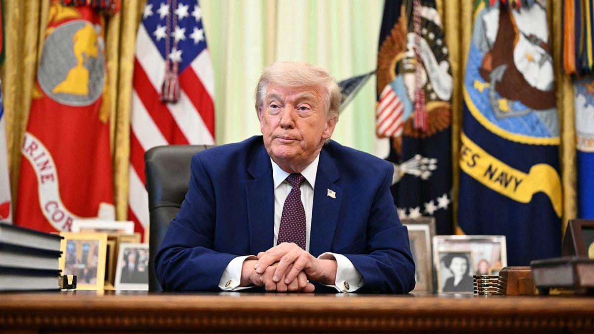 President Donald Trump speaking to the press in the Oval Office