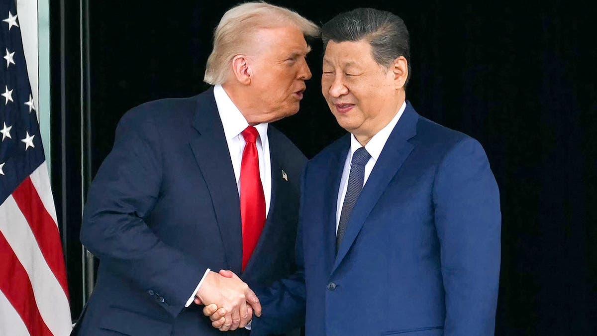 Trump and Xi Jinping shake hands after meeting in South Korea.