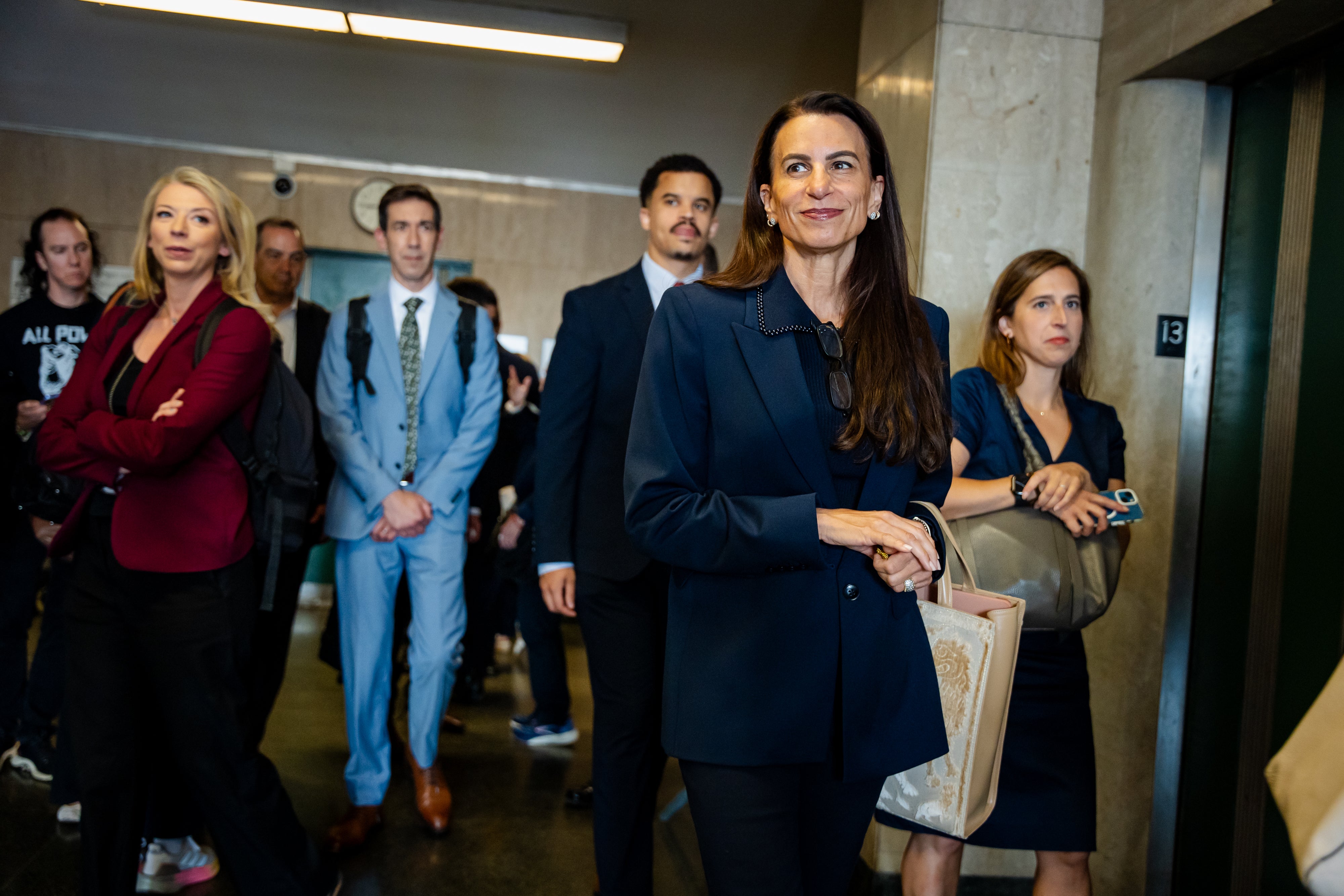 Karen Friedman Agnifilo, one of Luigi Mangione’s attorneys, leaves the hearing room after it was announced that Mangione would not appear in court that day at Manhattan Criminal Court