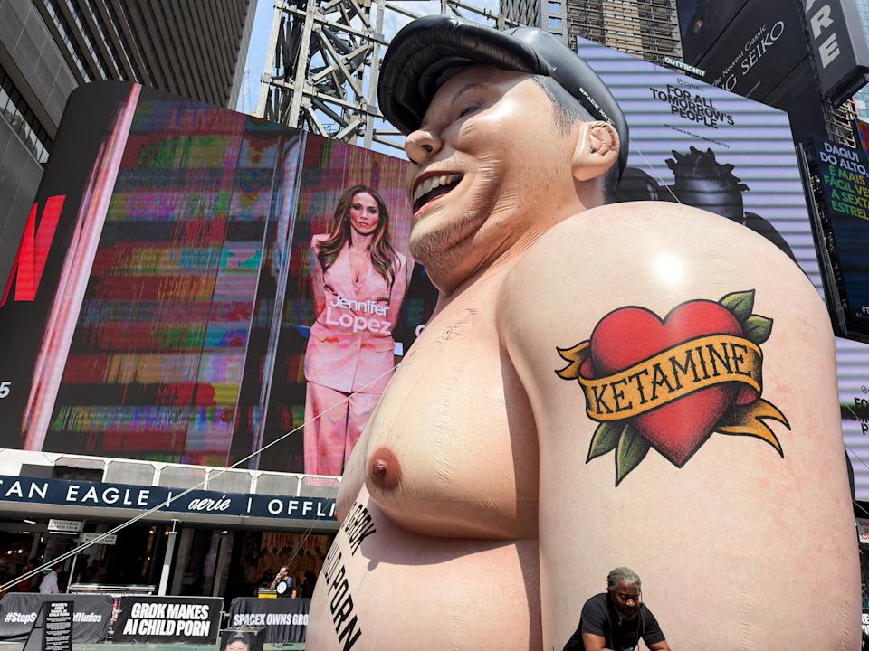 An inflatable Elon Musk in Times Square