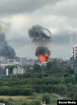 Flames and smoke rise from Moscow's main oil refinery following a Ukrainian strike on the morning of June 18.