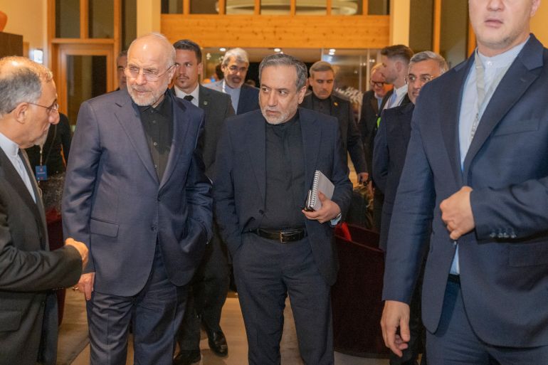 epa13052908 Iran's Speaker of the Islamic Parliament, Mohammed Bagher Ghalibaf (L), and the Minister of Foreign Affairs of Iran, Seyyed Abbas Araghchi (C), attend a meeting at the Bürgenstock resort in Obbürgen, near Lucerne, Switzerland, Sunday, 21 June 2026. Following the signing of a framework agreement on peace in France this week, delegations from the USA and Iran meet at the Bürgenstock resort to discuss further details and technical issues. EPA/URS FLUEELER