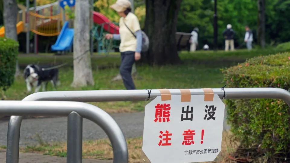 A sign warning of bears is posted at the entrance of a park in Utsunomiya City, Japan on June 8, 2026. - Kotaro Numata/Yomiuri Shimbun/AP