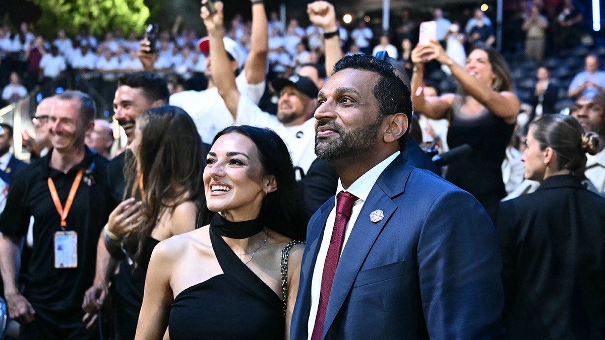 FBI Director Kash Patel standing with singer Alexis Wilkins on the South Lawn of the White House