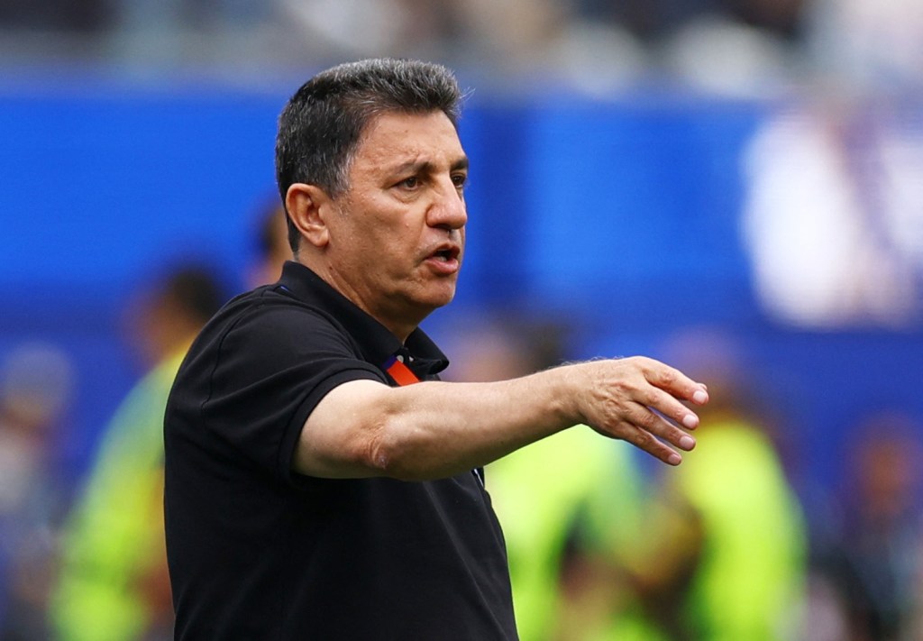 Iran coach Amir Ghalenoei reacts.