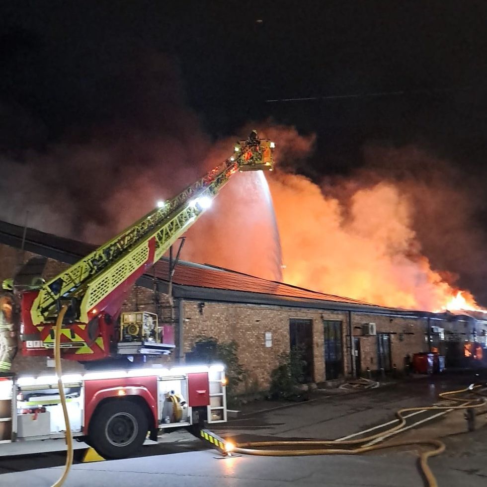 Firetruck extinguishing warehouse blaze