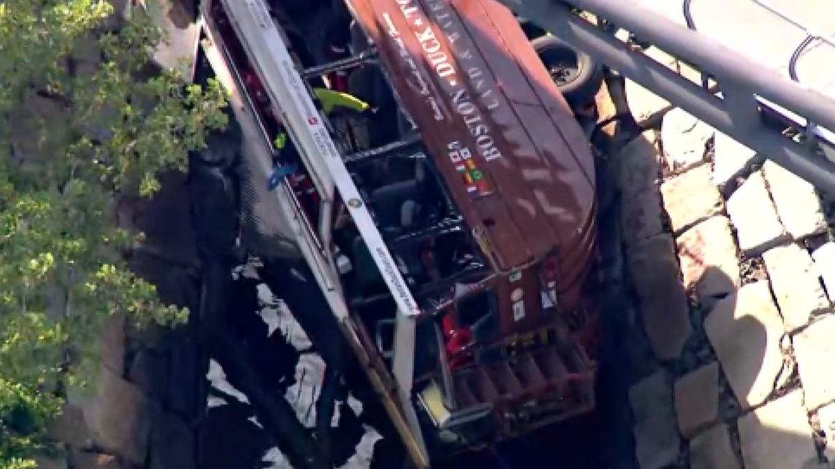 The overturned duck boat appeared mangled following the crash Saturday.