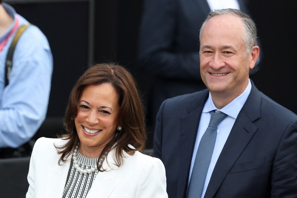 Former U.S. Vice President Kamala Harris and her husband Doug Emhoff smile at the dedication ceremony for the opening of the Obama Presidential Center in Chicago.