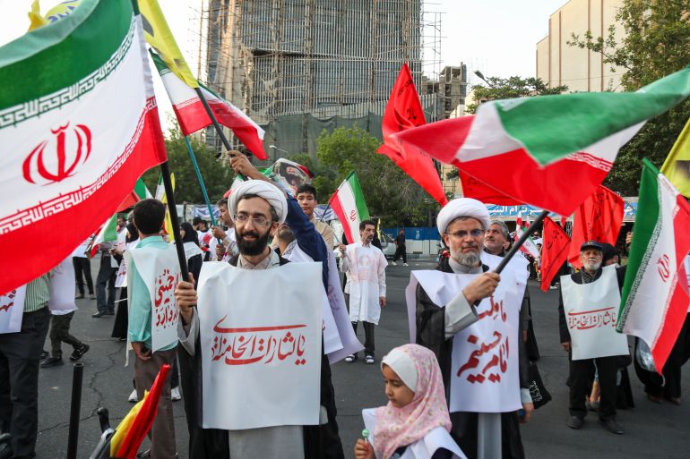 TEHRAN, IRAN - JUNE 12: People from Tehran province gather in support and allegiance to Iranian Supreme Leader Mojtaba Khamenei, while holding Iranian flags and images of both the new and former leaders of Iran, on June 12, 2026 at Palestine Square in Tehran, Iran. (Photo by Majid Saeedi/Getty Images)