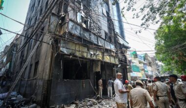 Fire tears through hotel in India's capital in Delhi, killing at least 21 people as some jump from windows