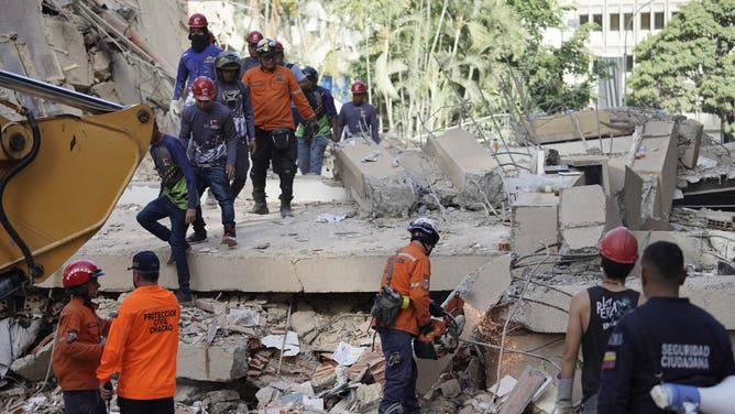 CARACAS - VENEZUELA - JUNE 25: Search and rescue team work on a collapsed building after an earthquake in Caracas, Venezuela, on June 25, 2026.