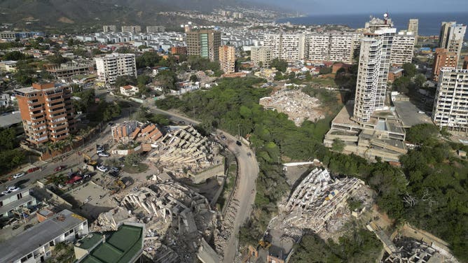 This aerial view shows collapsed buildings in Catia La Mar, La Guaira state, Venezuela, on June 27, 2026, following earthquakes that struck the region.
