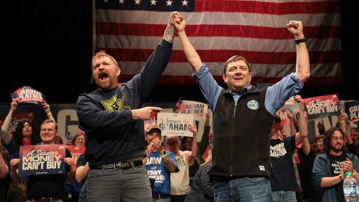 Democratic Senate candidate Graham Platner and gubernatorial candidate Troy Jackson standing together at University of Maine campus