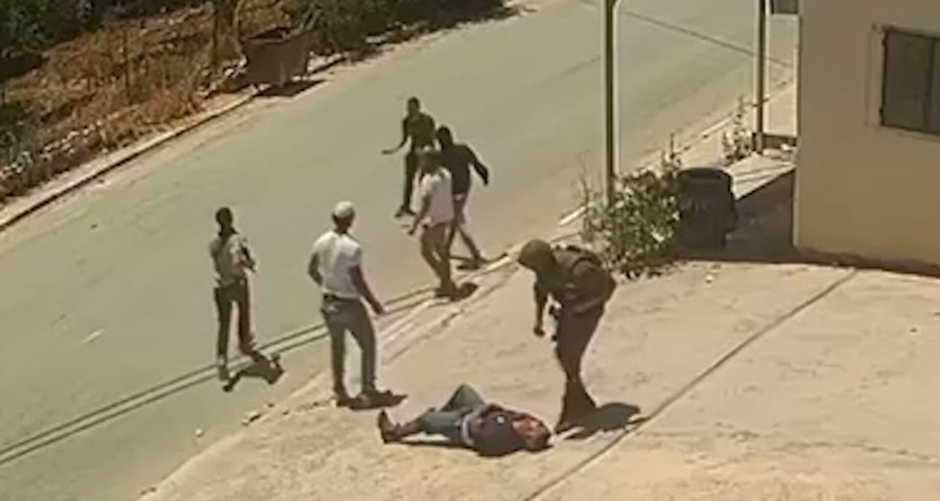 Video shows Israeli soldier and settlers assaulting two Palestinians | Occupied West Bank