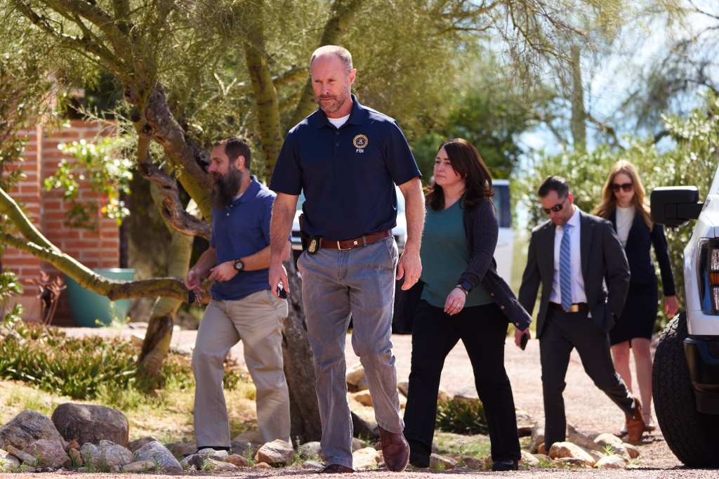 FBI investigators examine the residence of Nancy Guthrie in Tucson, Arizona.