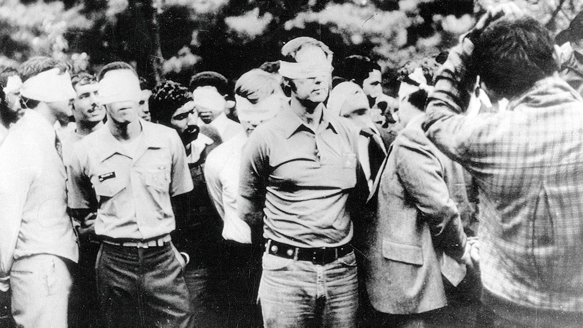 American hostages shown outside U.S. Embassy in Tehran in 1979.