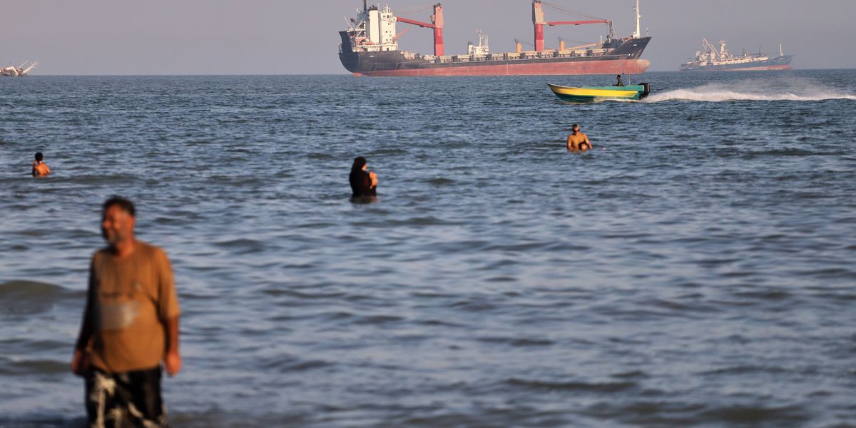 An oil tanker navigates the Strait of Hormuz despite threats from Iran's Revolutionary Guard