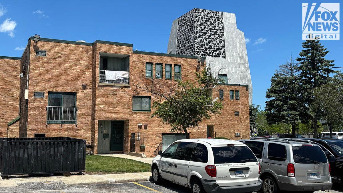 The Obama Center towers over a residential complex.