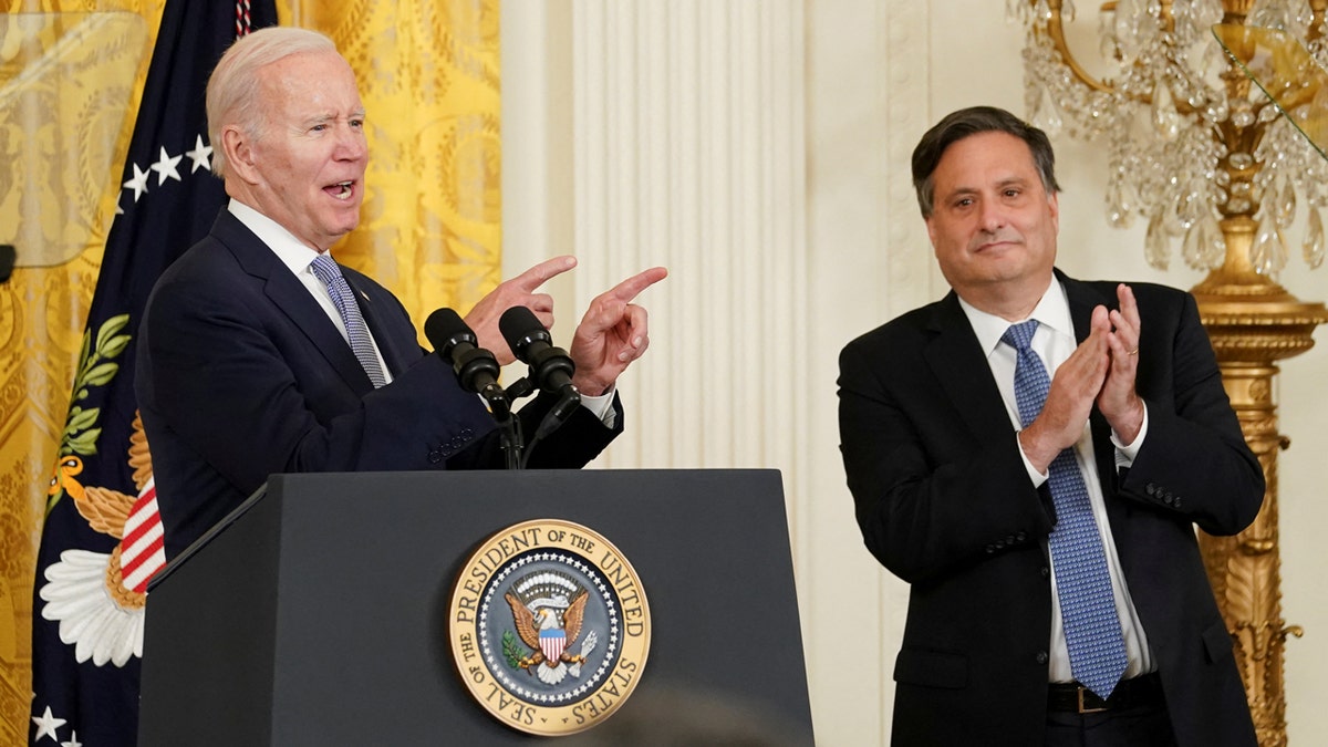 President Joe Biden speaking at an official transition event indoors.