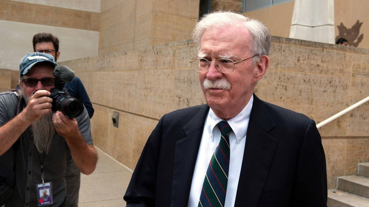 Former Trump administration national security adviser John Bolton departs the U.S. District Court in Greenbelt, Va., Friday, June 26, 2026. (AP Photo/Cliff Owen)