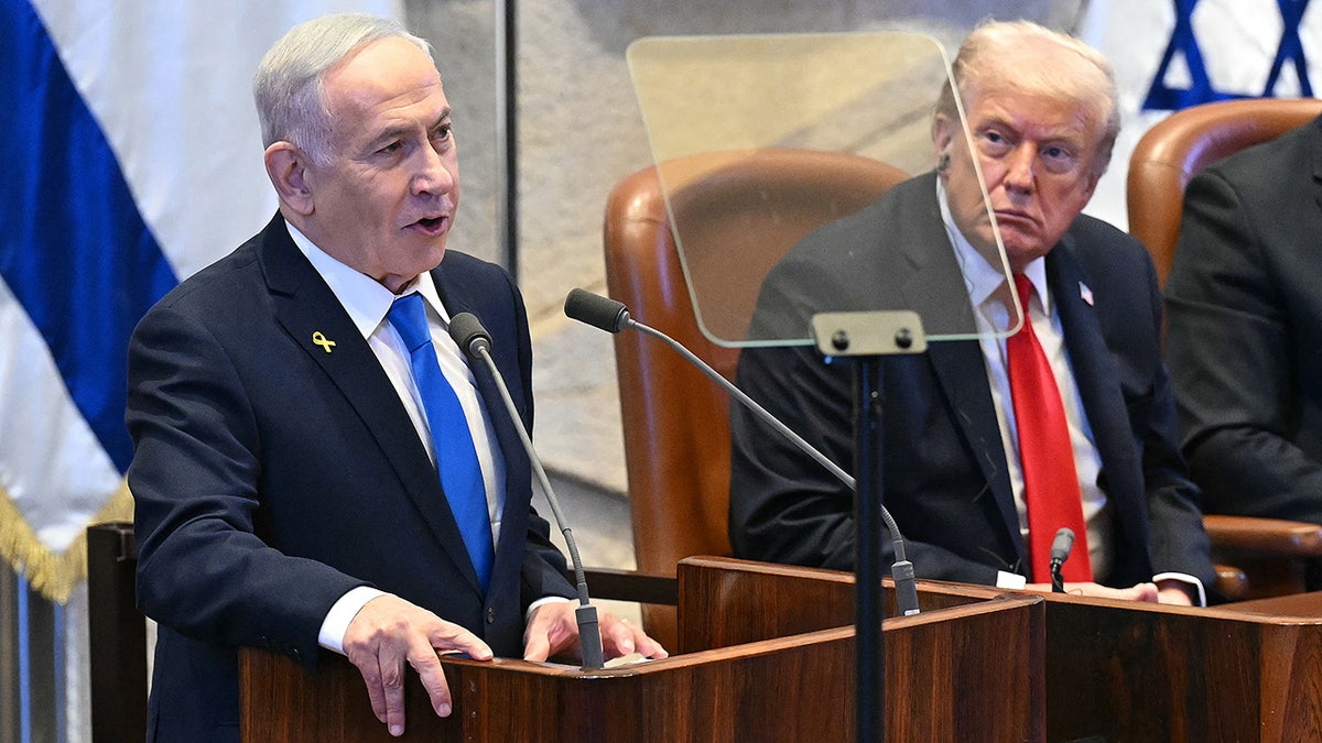 President Donald Trump listens to Israeli Prime Minister Benjamin Netanyahu addressing the Knesset in Jerusalem.