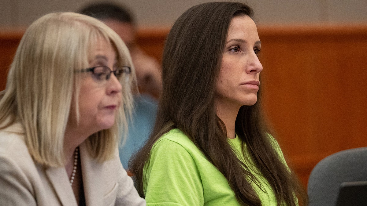 Kouri Richins seated with defense attorney Wendy Lewis in court