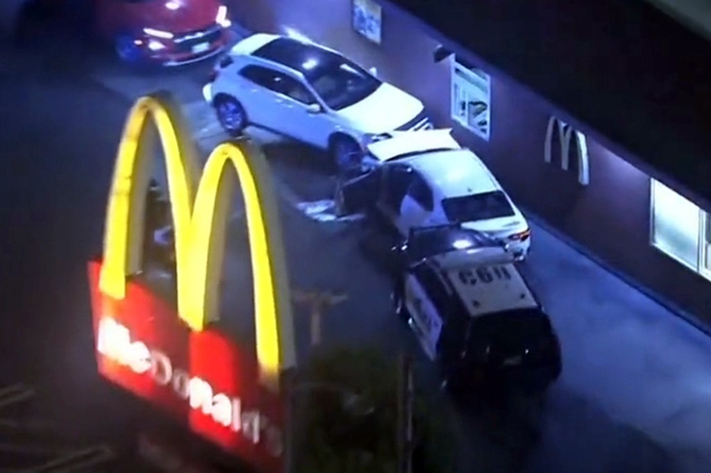 Police vehicle involved in a crash near a McDonald's sign during a pursuit in Culver City.