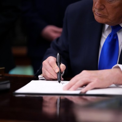 Trump signs order moving thousands of federal employees into Schedule F