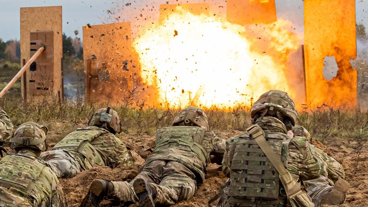 U.S. Army Soldiers with 9th Brigade Engineer Battalion constructing an improvised door handle charge in Adazi, Latvia
