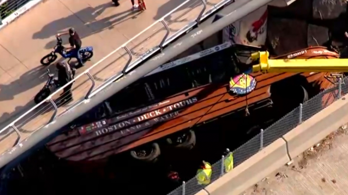 Photos showed a large police response after a duck boat flipped in Boston.