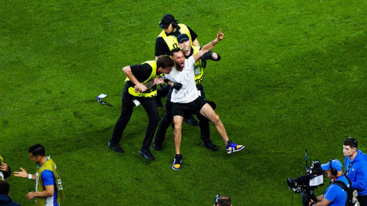 Iran celebrated a stoppage-time winner before VAR overturned it, moments after a pitch invader briefly disrupted the World Cup match.